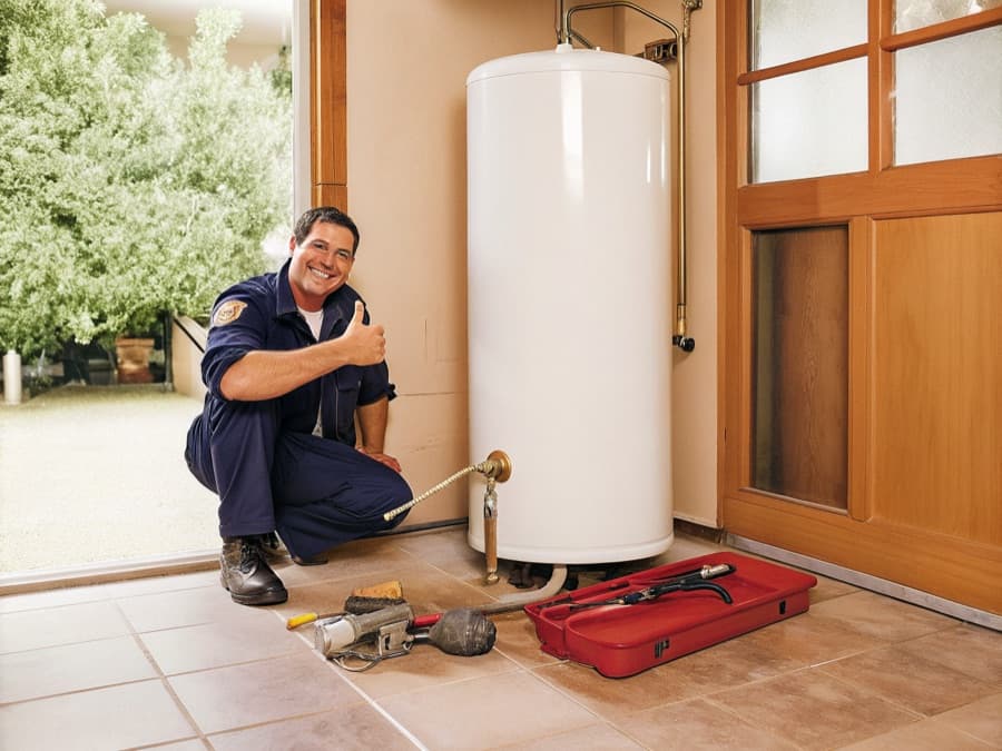 Plumber installing a water heater